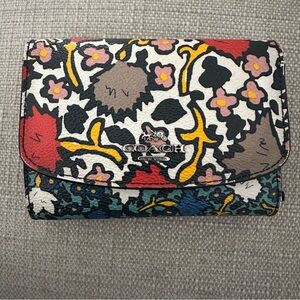 Coach Trifold Floral Women's Wallet with coin pocket.